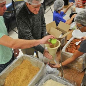 Volunteers Measuring Food | Meals of Hope Marco Island - Meal Packing to End Hunger